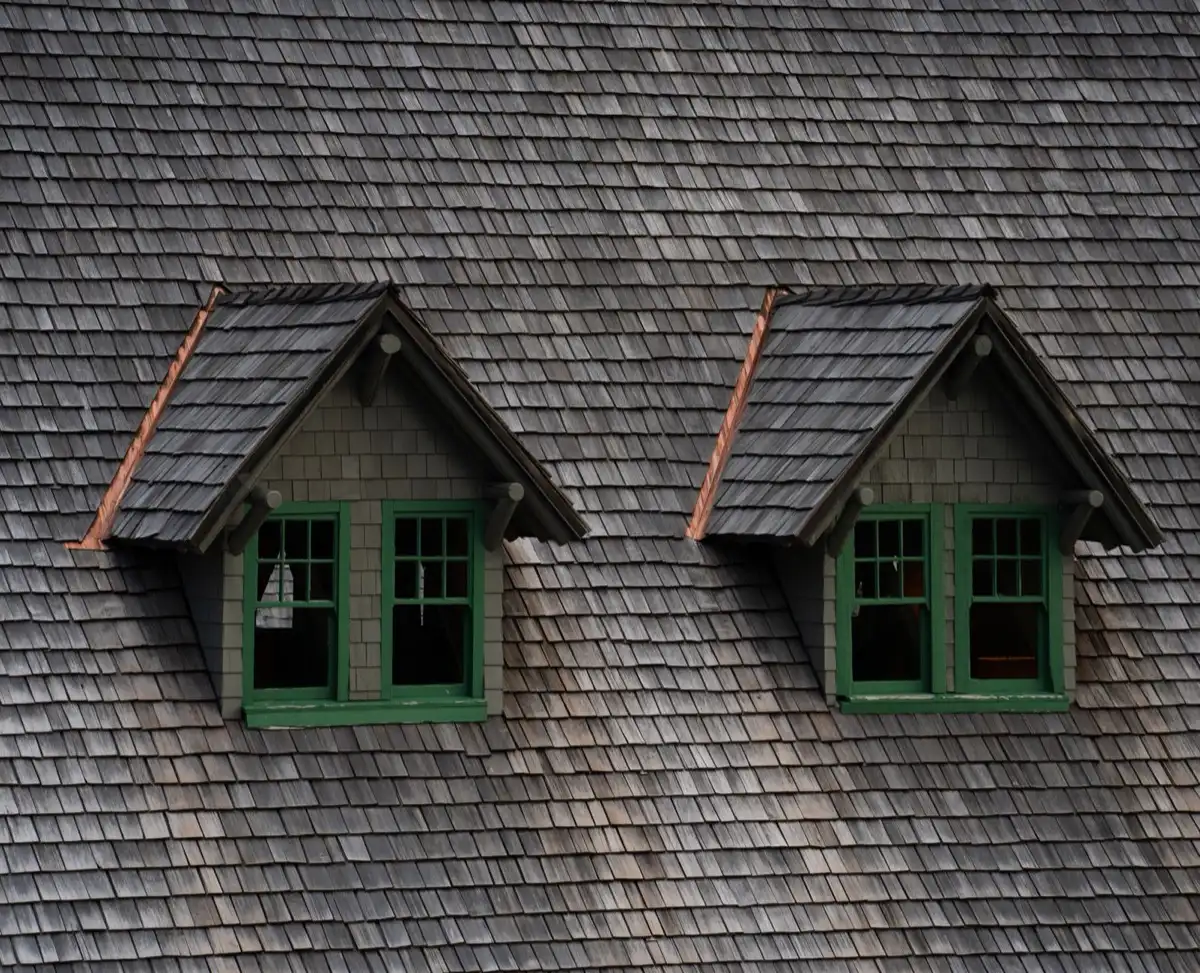 Dormers on a shingle roof in Sierra Vista, AZ, where step flashing and kickout flashing carry water past the walls